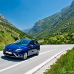 Home 5 몬테네그로 내 주요 사건사고 - **Prompt 1: Montenegrin Mountain Road Adventure**
"A stunning, high-angle panoramic shot of a wi...